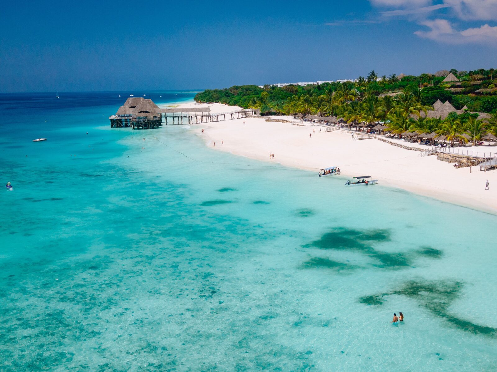 Aerial view of a Zanzibar resort beach with stilt pier