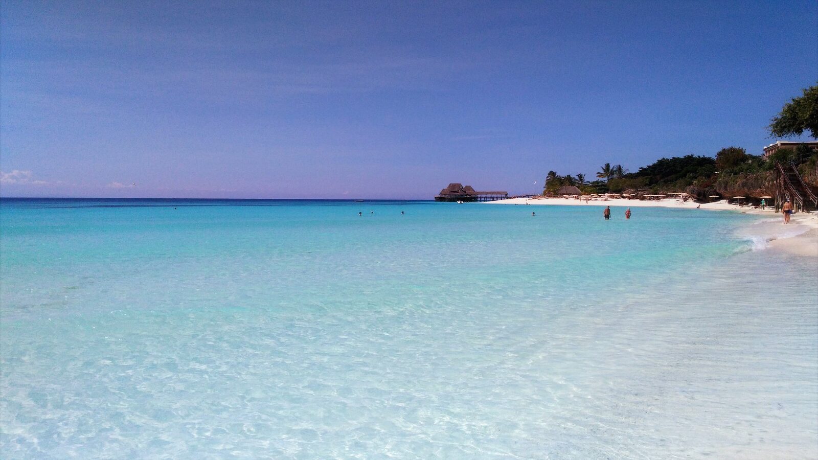 Clear turquoise water beside a Zanzibar stilt jetty