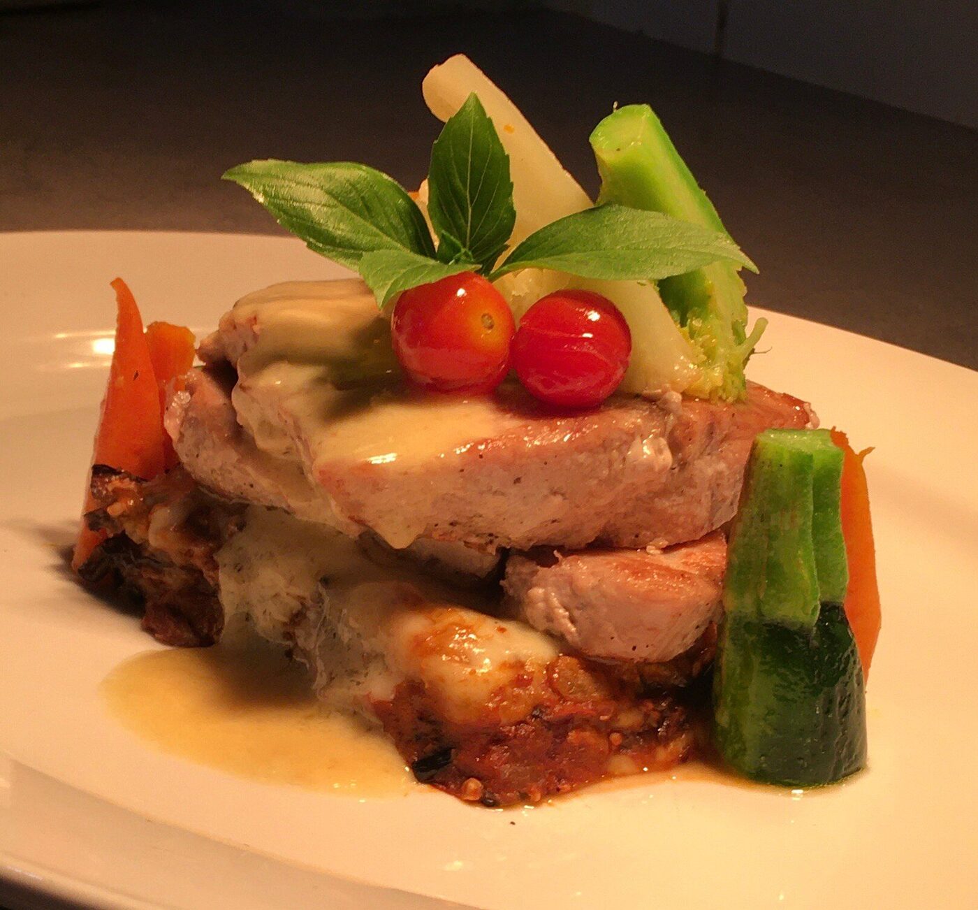 Grilled fish plated with vegetables