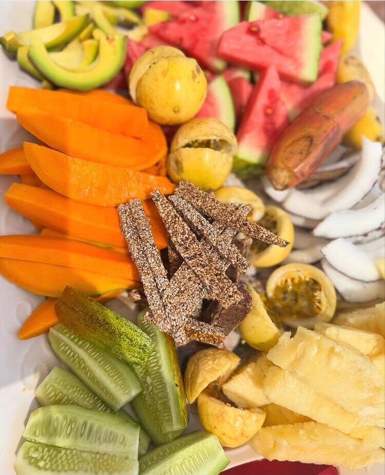 A platter of sliced tropical fruit