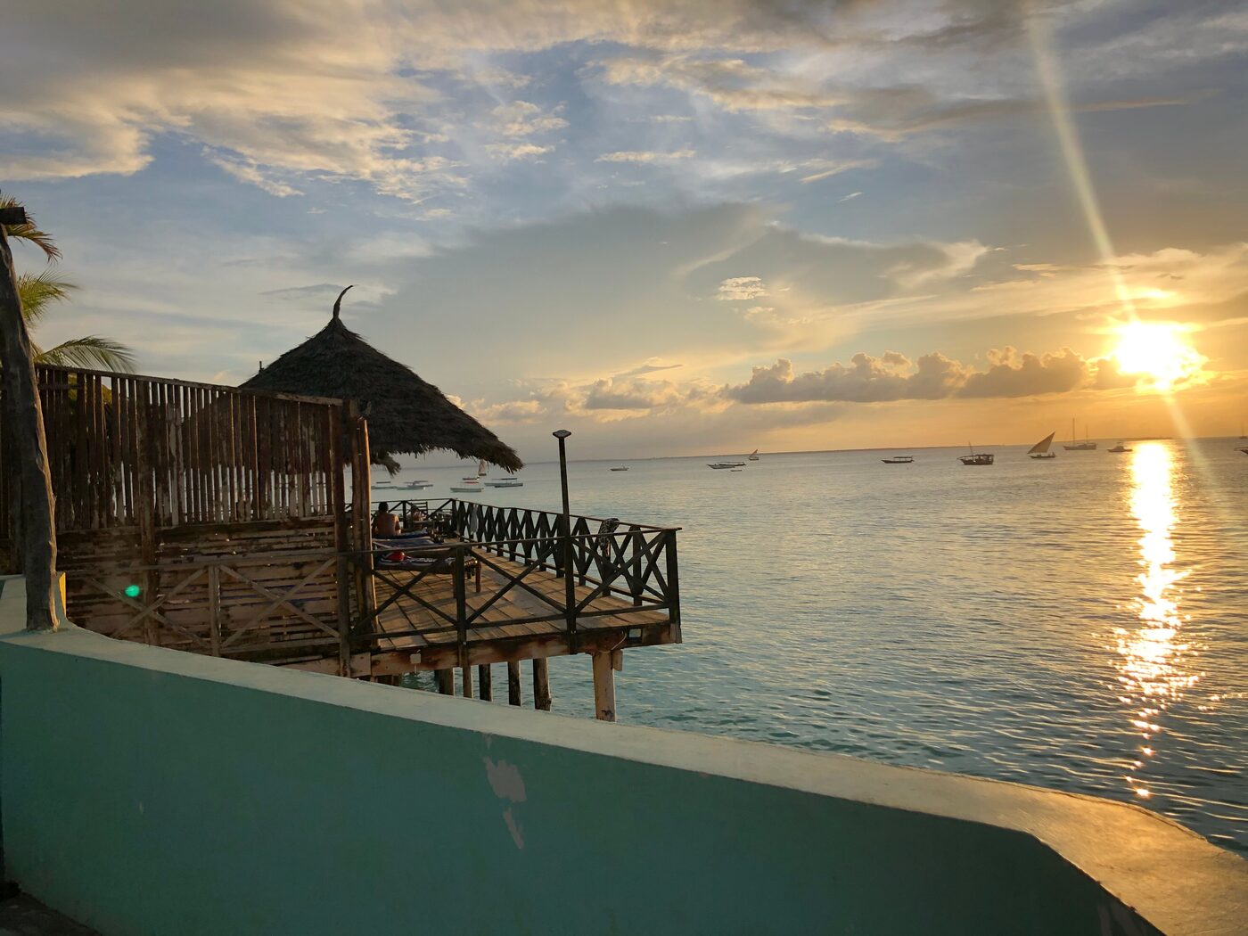Golden hour at a seafront jetty bar